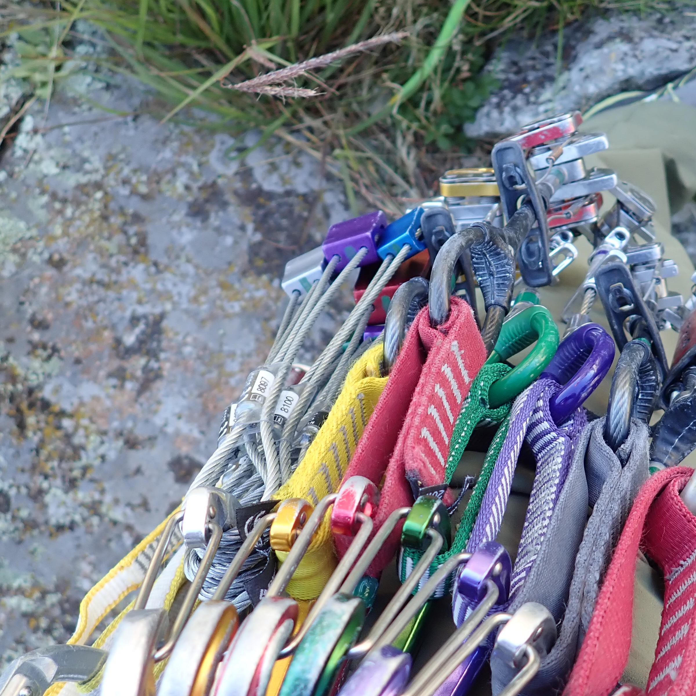 Climbing gear attached to the harness of a climber.