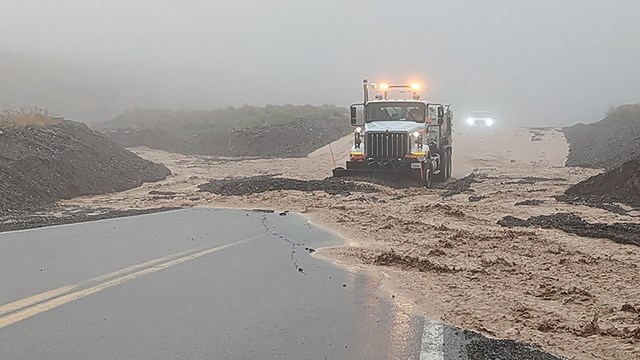 Rocks, mud and floodwater being cleared from highway 190 after heavy rains hit Death Valley.
