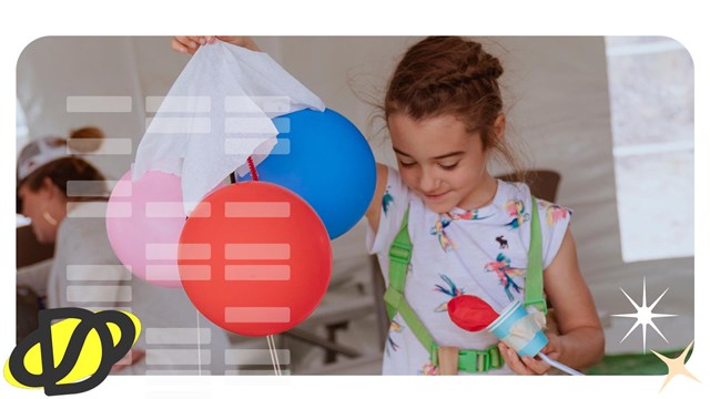 A child constructs an arts and crafts "Mars Rover" with balloons.