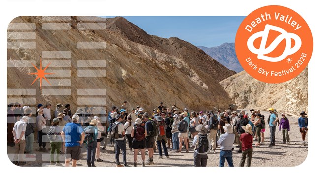 A crowd in a desert canyon.