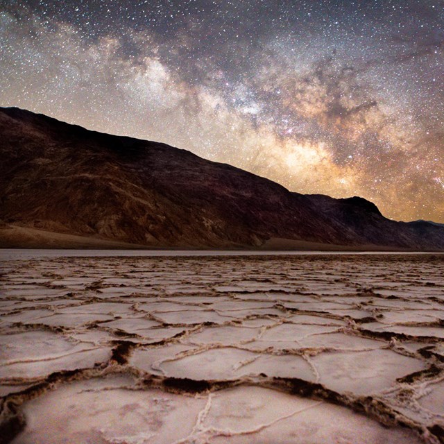 Picture of the night sky above the salt crust, with the Milky Way prominent. NPS/Patrick Taylor