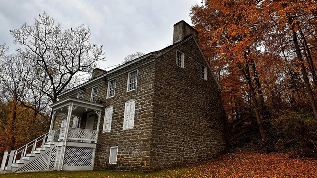 The Van Campen Inn surrounded by fall foliage.