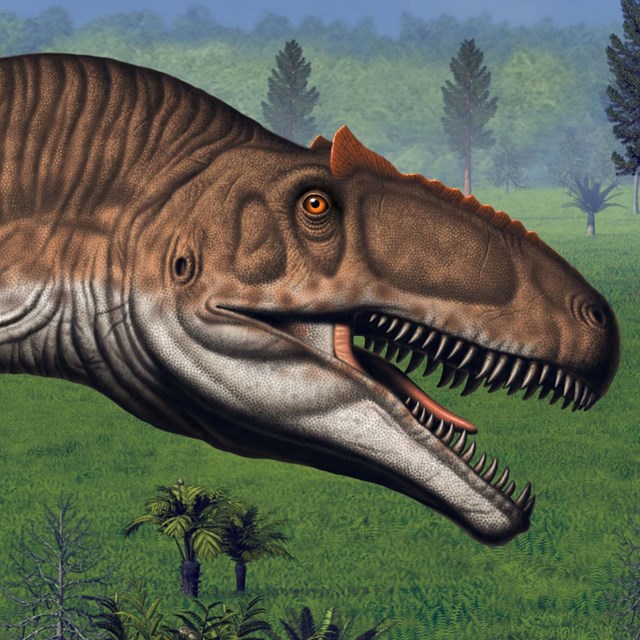 A sharp-toothed meat eating dinosaur with an open mouth.