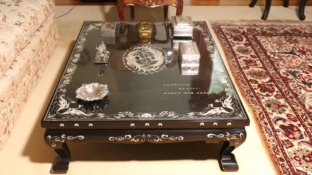 A color image of a black Korean coffee table in the Eisenhower living room