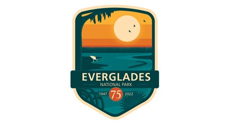 A logo reading Everglades National Park 1947, 75, 2022