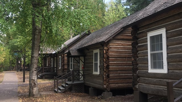 Row of log cabins.