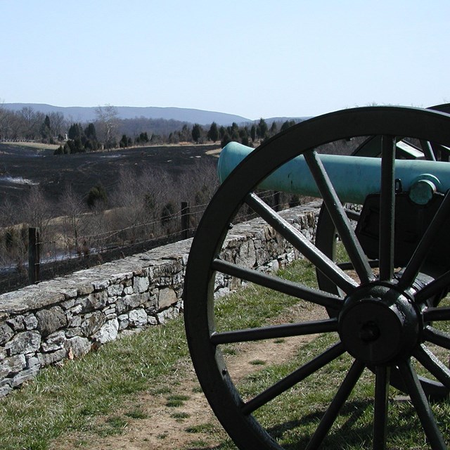 Old cannon at Antietam National Battlefield frames the view post burn.