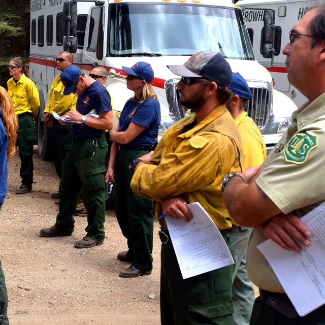 Firefighters from different agencies attend a fire briefing.