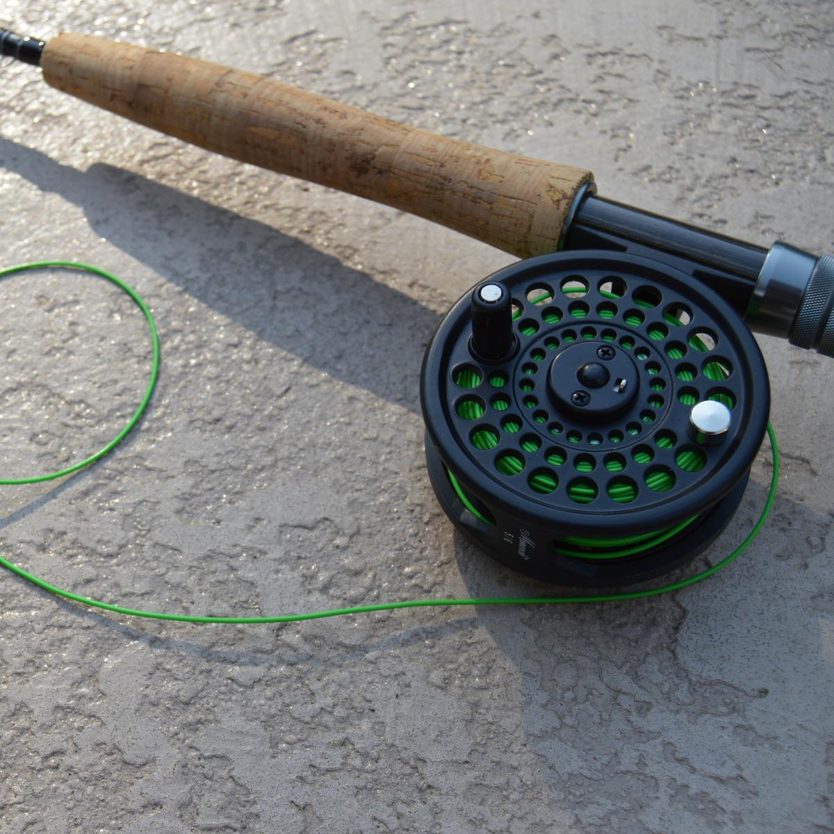 Close up of rod, reel, and line for fly fishing. 