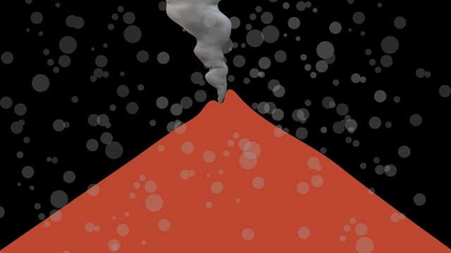 A large brown smoking volcano erupting volcanic ash. 