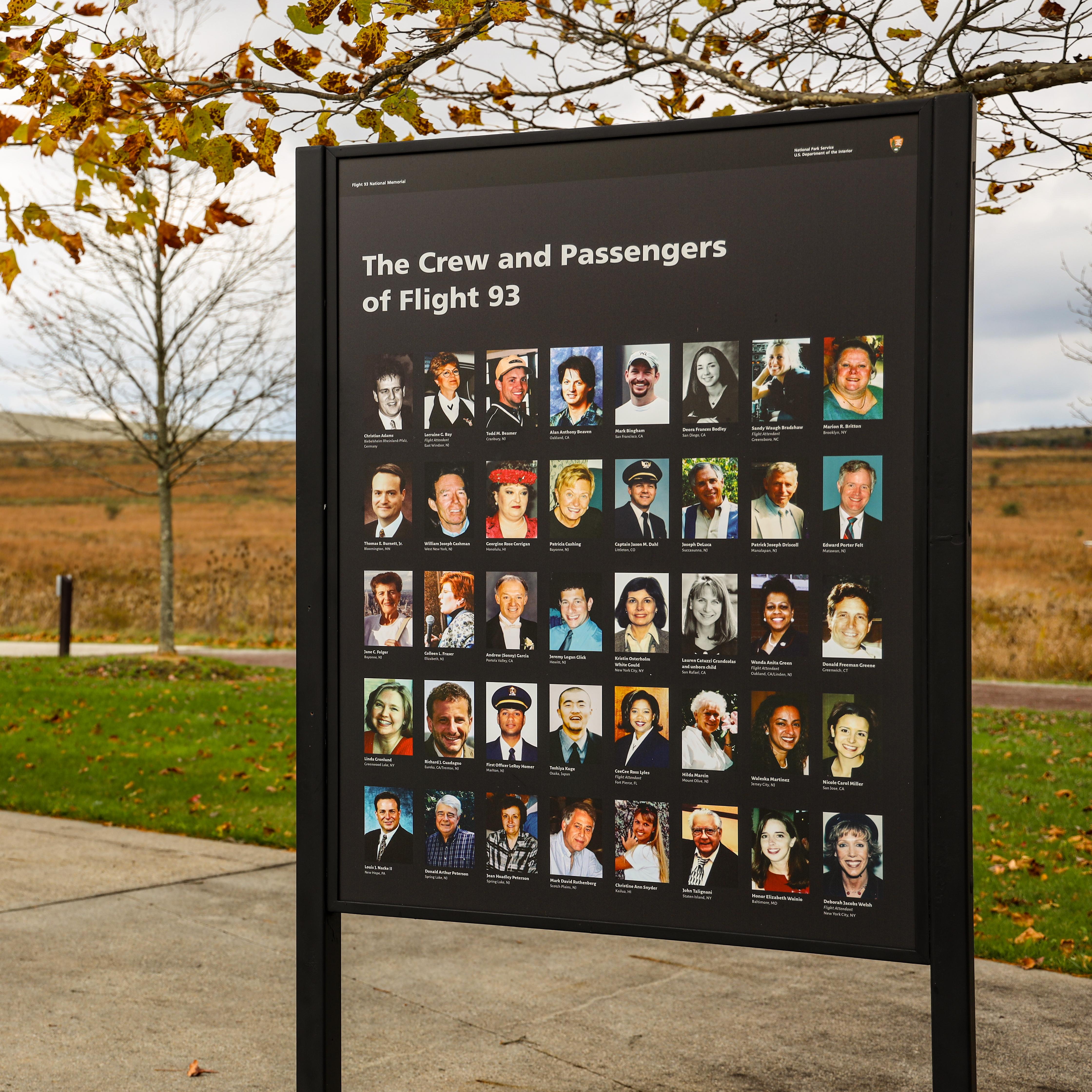 An informational sign at the memorial with photos of the crew and passengers of Flight 93
