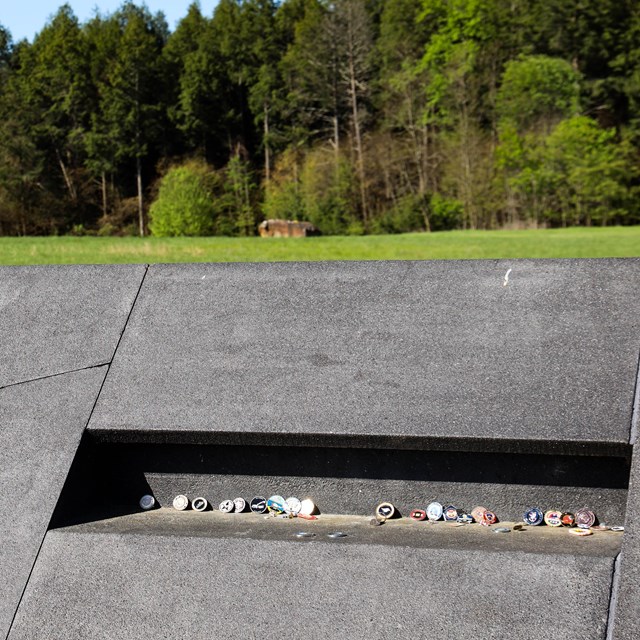 Tribute items in niche at the Memorial Plaza.