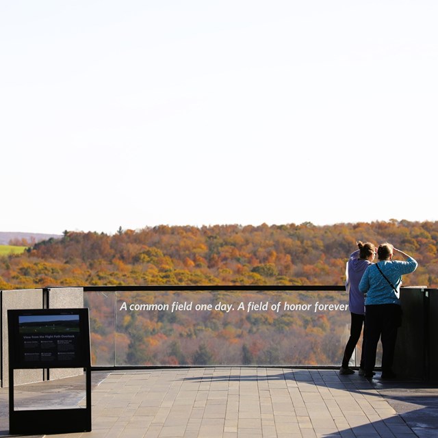 Visitors at the flight path overlook