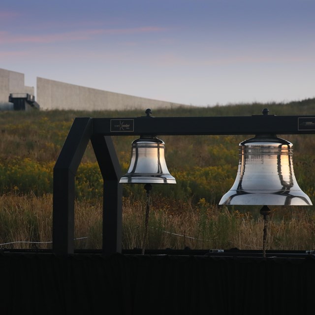 Two large bells known as the Bells of Remembrance sit in the field below the visitor center.