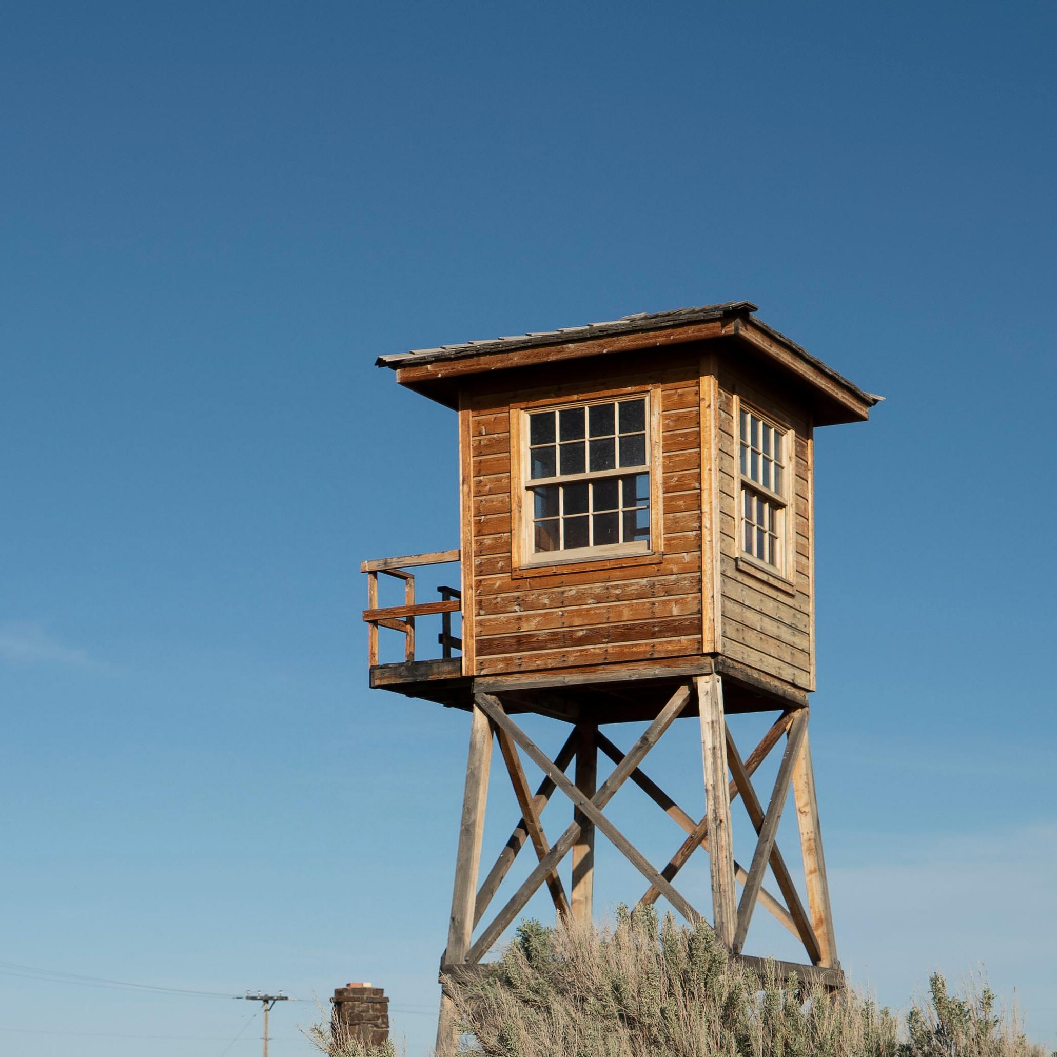 Wooden guard tower on stilts.