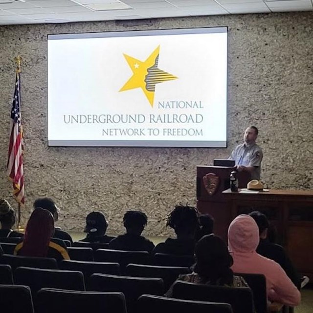 Image of ranger presenting a program