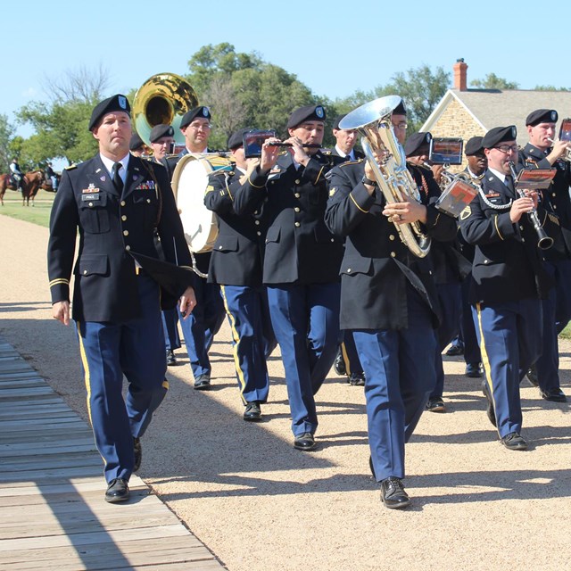 Army band marching.