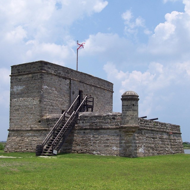 Fort Matanzas National Monument is centered with cloudy sky in the background 