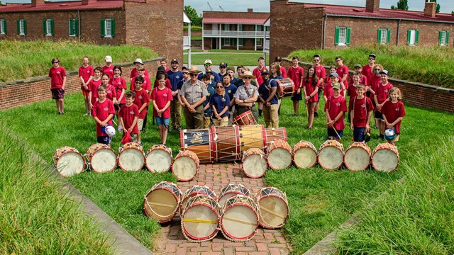 Fife and drum camp members posing on bastion.