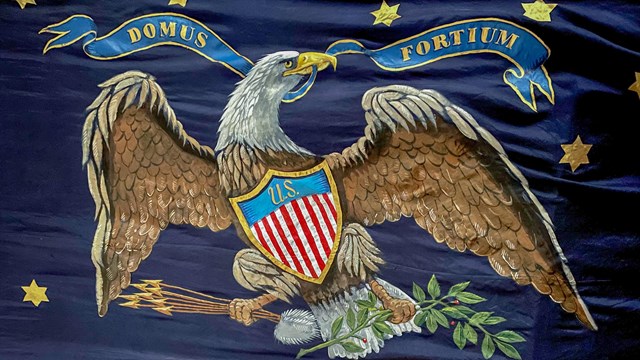 Blue flag with eagle and Fort McHenry Guard logo