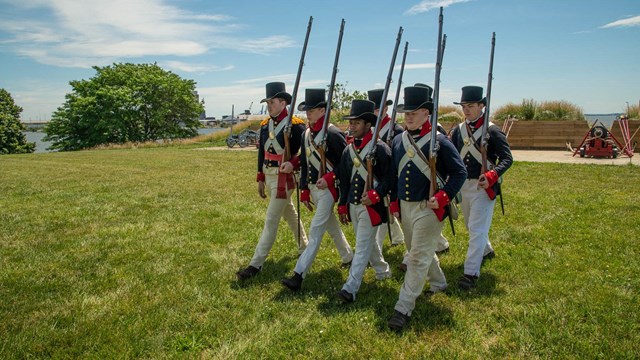 War of 1812 living history in a marching formation in front of the water battery.