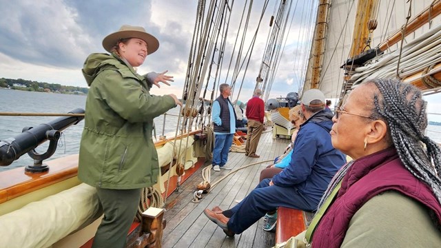 Three rangers mapping a route outdoors