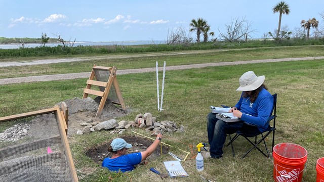 Archeologists map soil layers at the Workers' Village site.