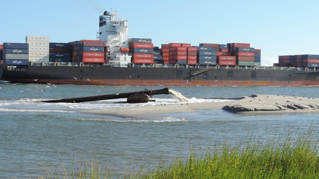 Dredging, spoil deposits, and cargo ships impact the coastline of Fort Pulaski.