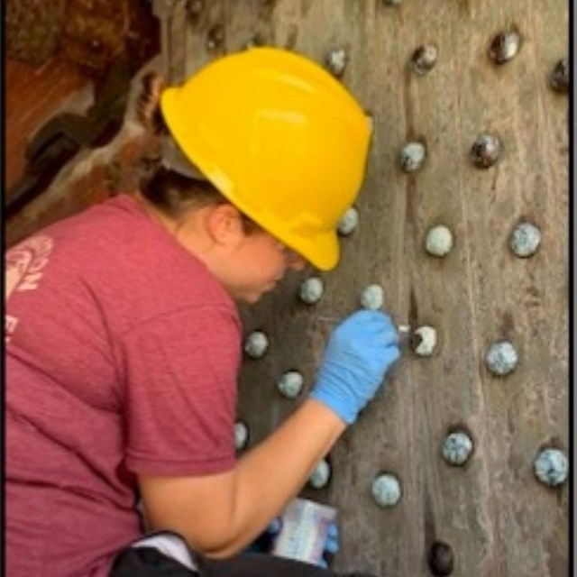 Women working on rivet's of Fort door 