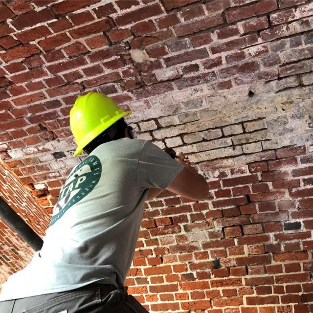 young men working on casemate masonry