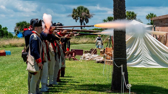 Living historians fire historic weapons on Carolina Day