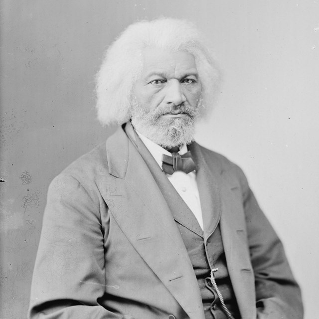 A black-and-white photograph of Frederick Douglass in his sixties