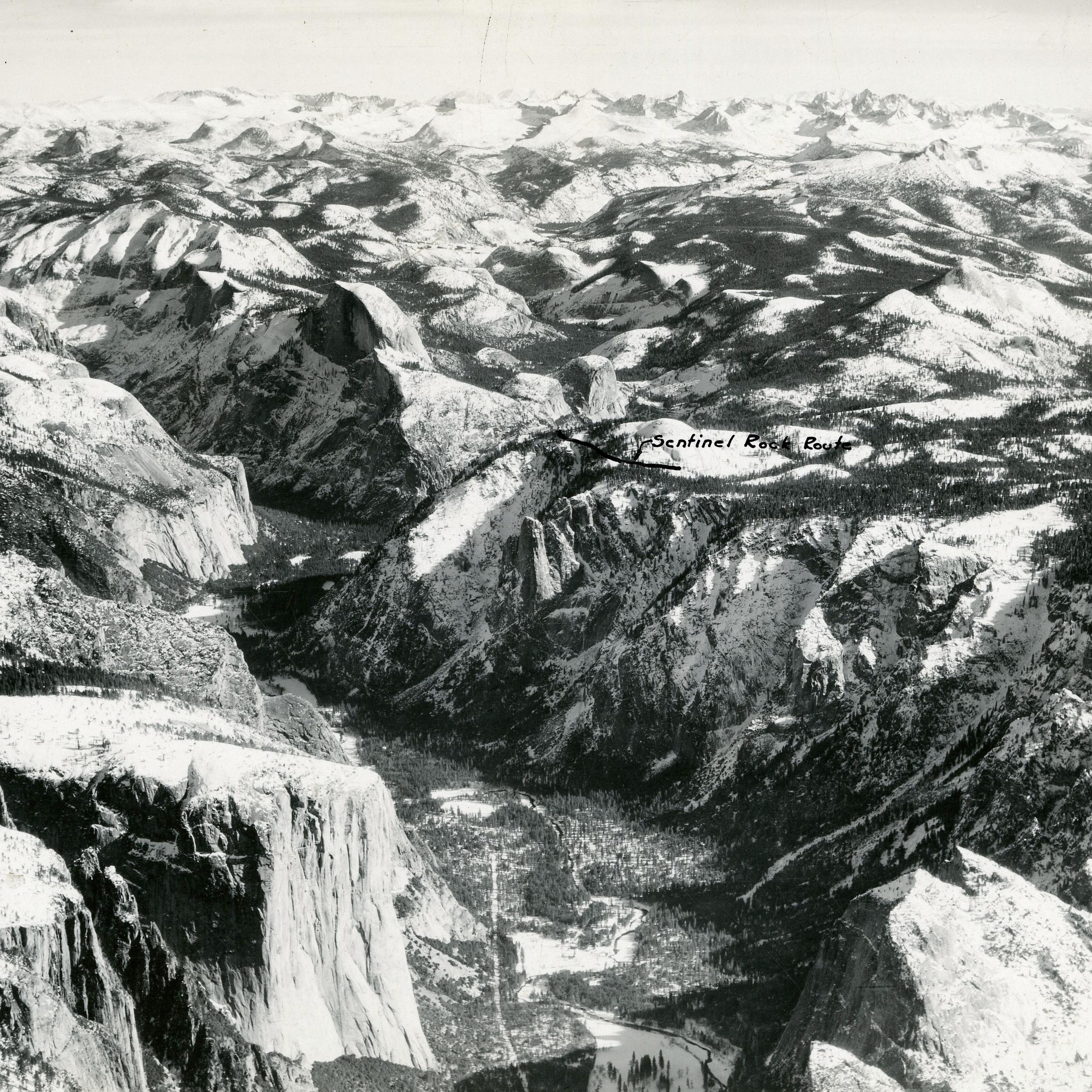 Black and white of snow capped mountains spreading for long distances