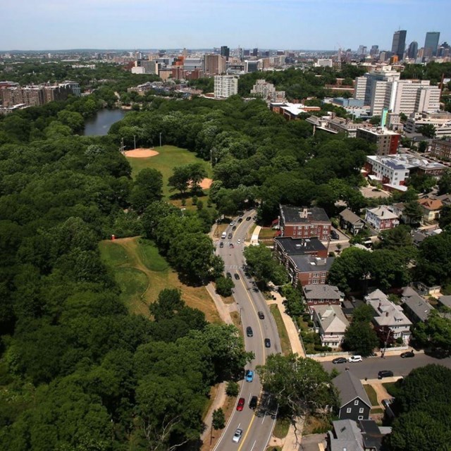 Aerial of city of Boston with green space and roads and buildings 