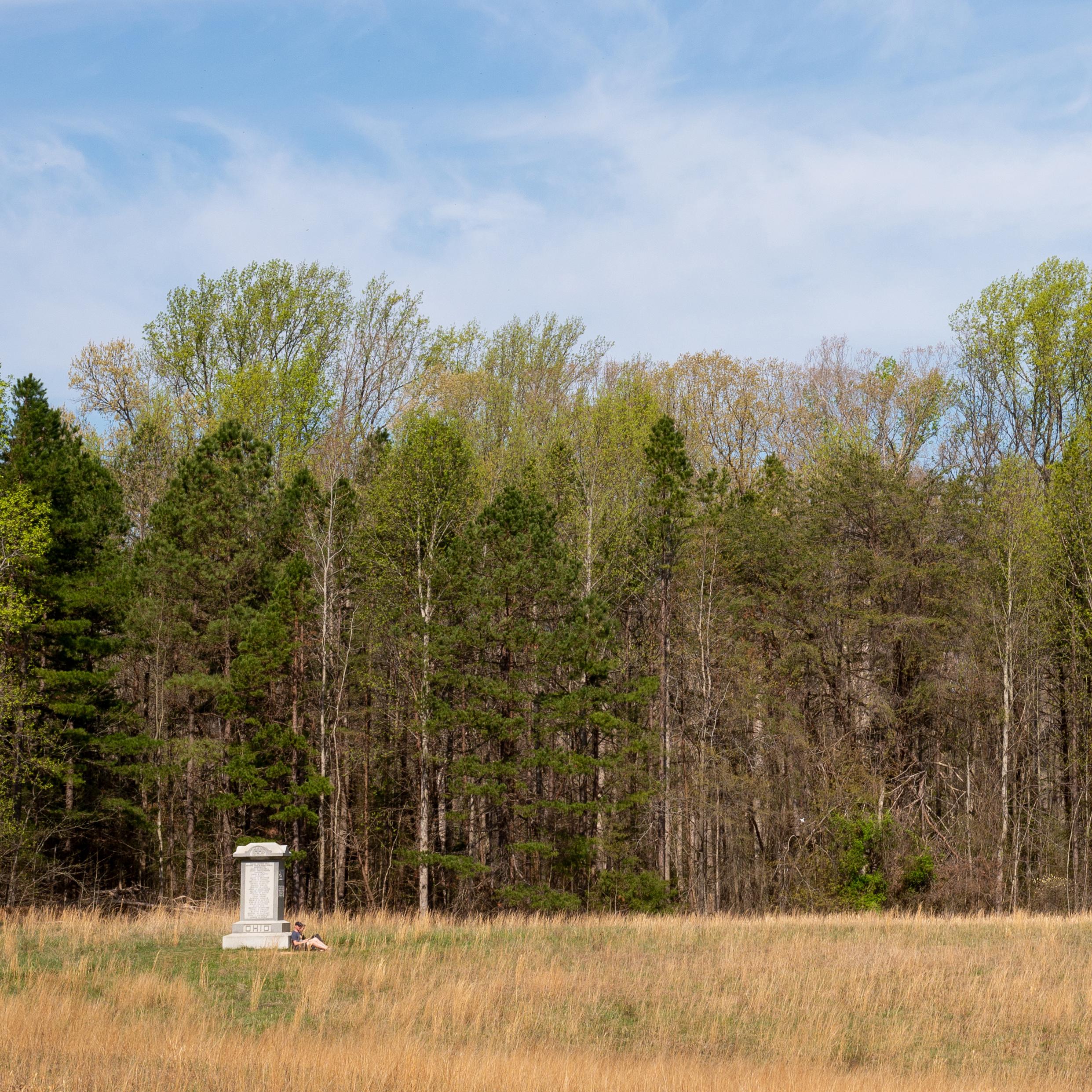 A granite monument across a wide field.