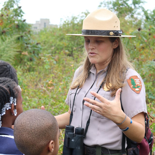 Ranger Erin outside with students