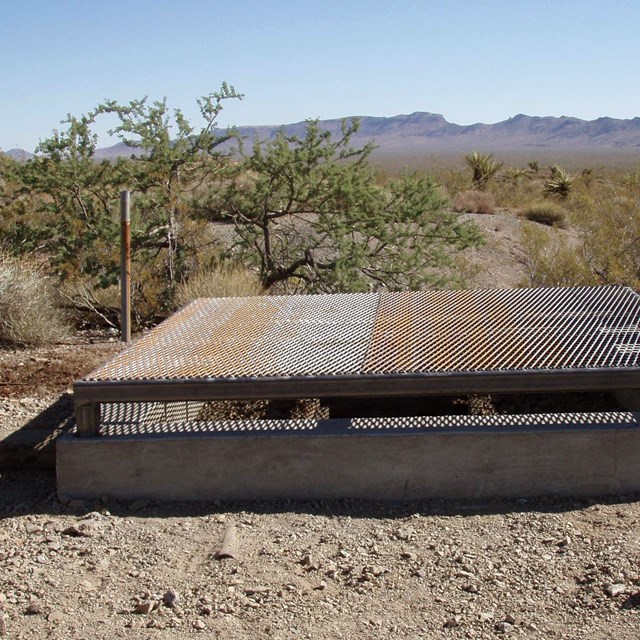 metal safety grate covering a mine shaft