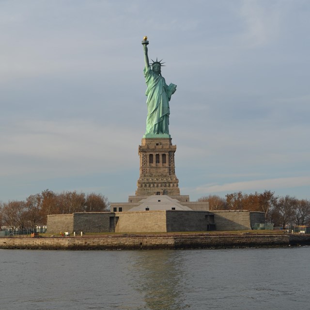 statue of liberty and liberty island's seawall