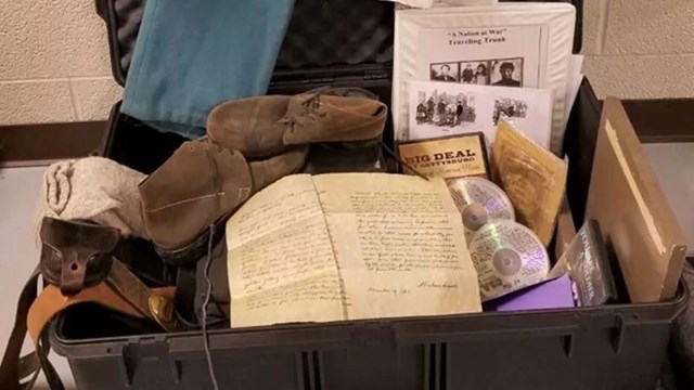 an open box with many items pouring out