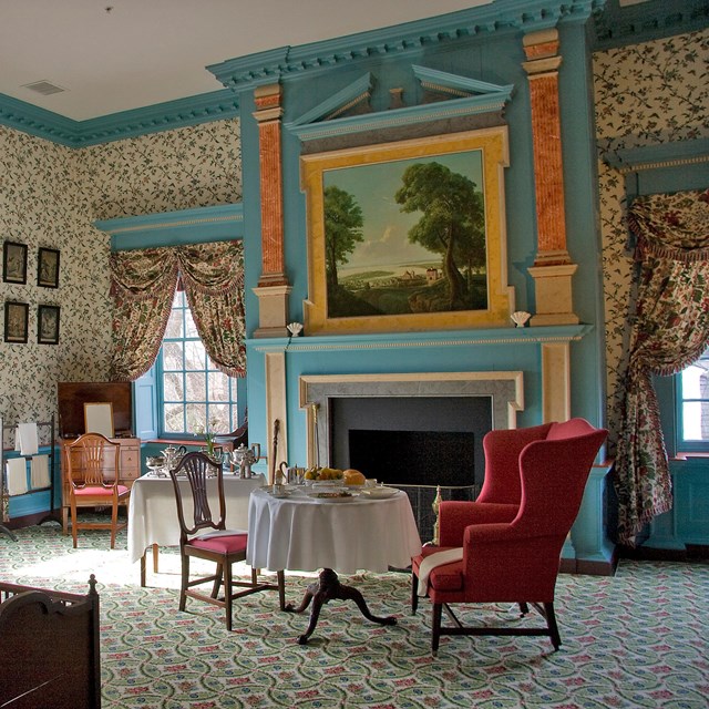 A large bedroom with ornate decorations. 