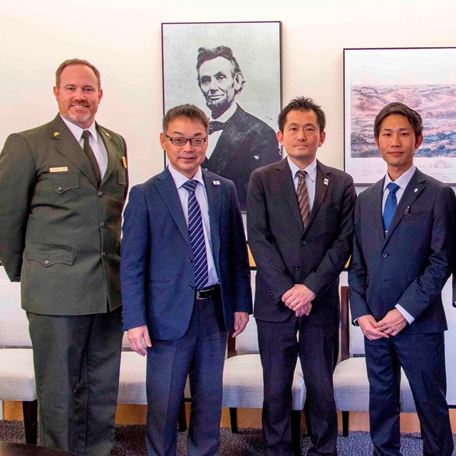 Sekigahara delegation standing beside Gettysburg National Military Park superintendent and deputy su