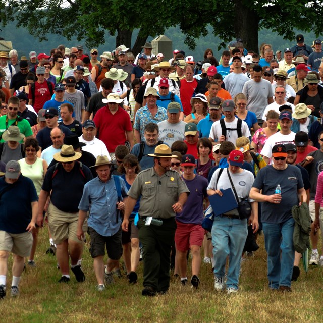 A park ranger leads a large group on one of the many ranger programs held throughout the year.