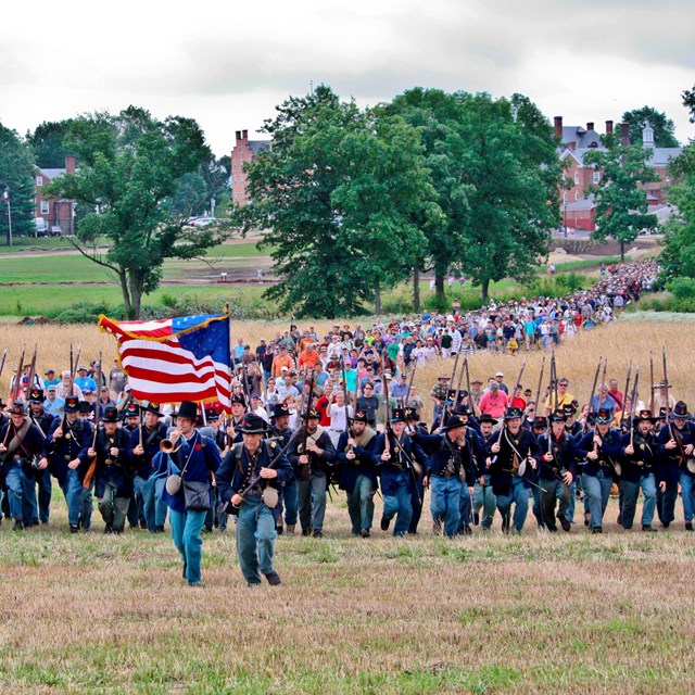 Union living historians charge toward the camera as part of ranger program on July 1, 2013.
