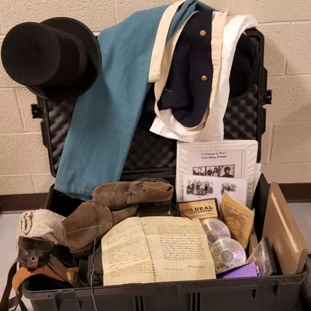 an open box with many items pouring out