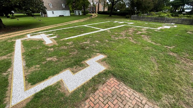 An outline of a foundation using crushed oyster shells.
