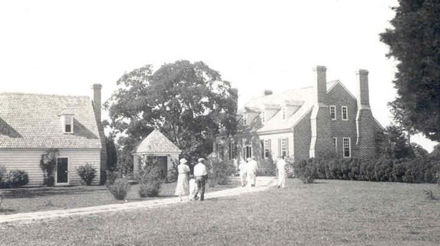 visitors walking beside colonial revival kitchen to the memorial house museum