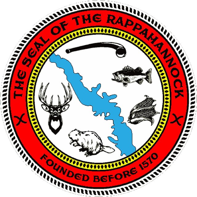 A seal that has images of a river, flintlock pistol, deer, beaver, bass, and corn.