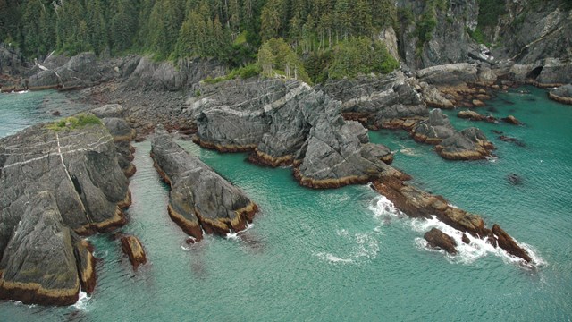 an aerial image of a rocky coastline