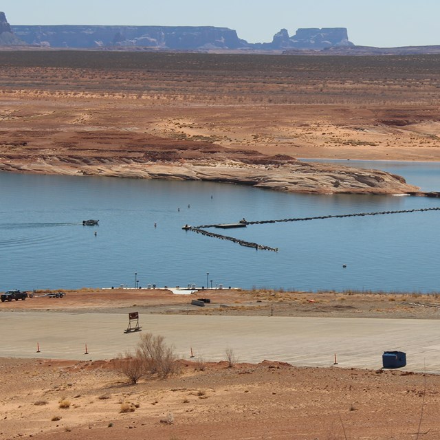 A boat launch ramp on a desert lake.