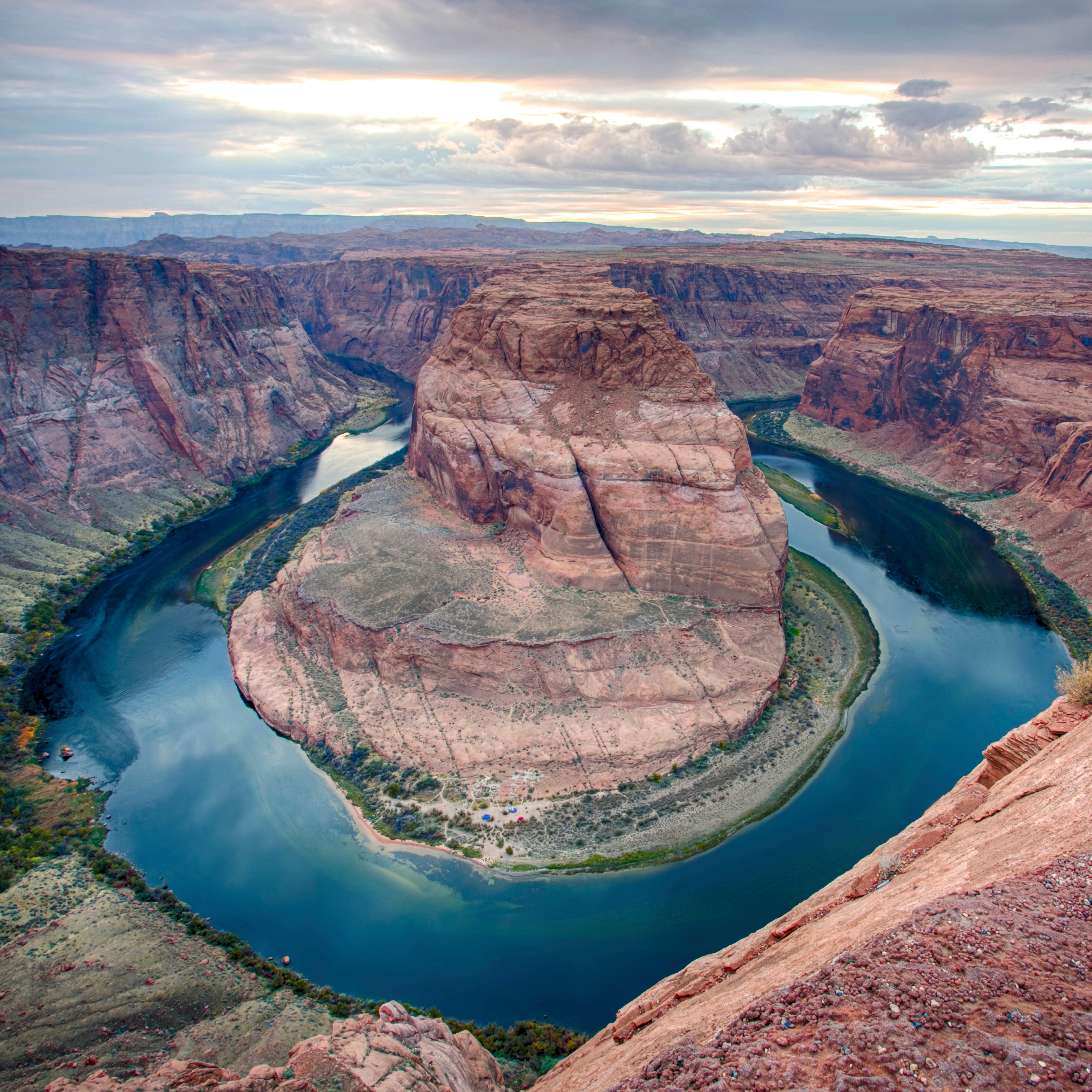 River makes a circular bend around sandstone escarpment.